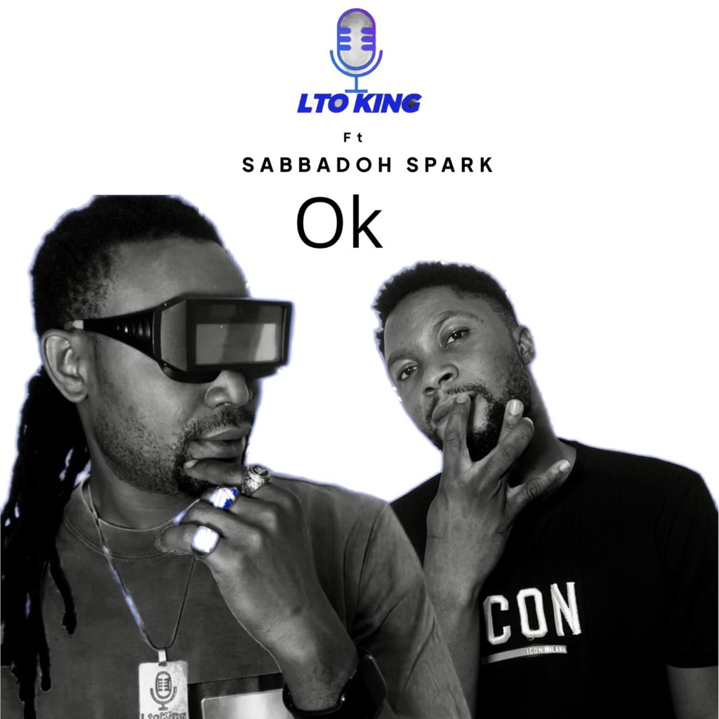 Image of two male musicians, LTO King wearing futuristic glasses and gestures thoughtfully, while Sabbadoh Spark in a black t-shirt poses with his hand near his face. Text includes 'LTO KING Ft Sabbadoh Spark Ok' at the top.
